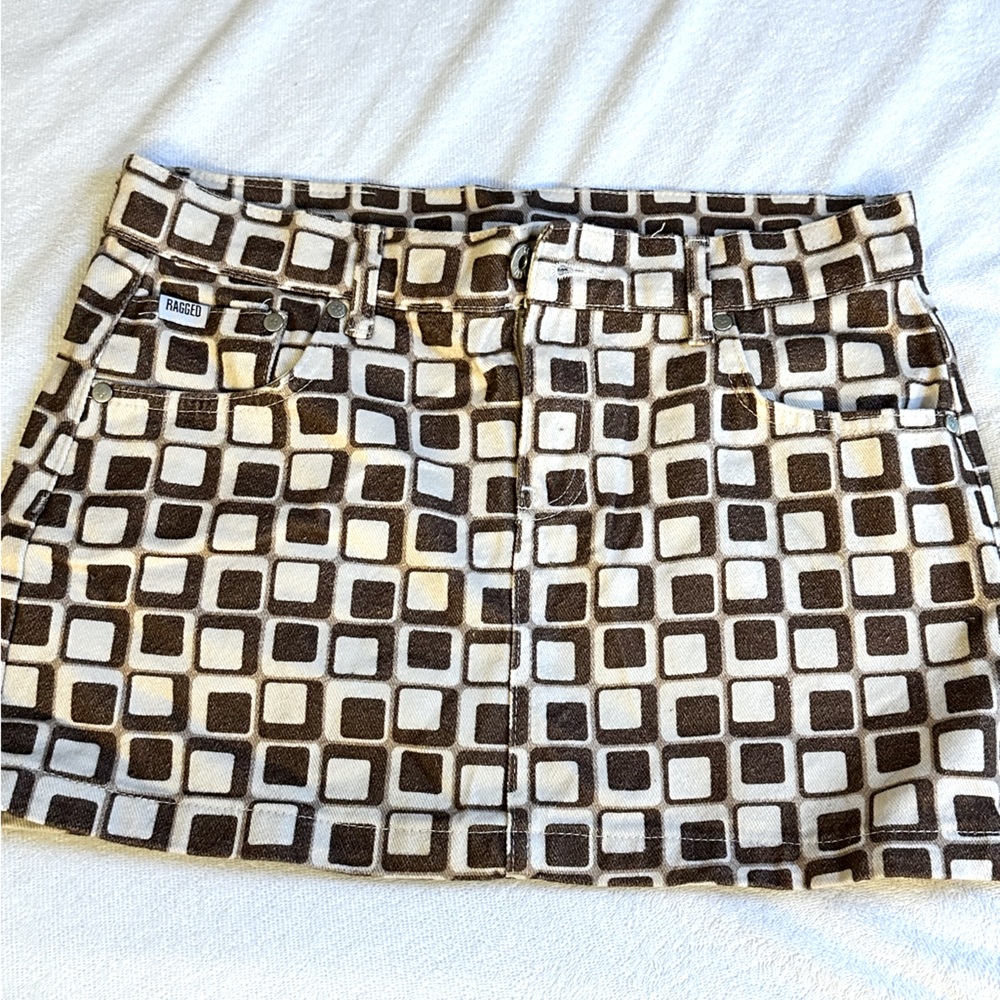 RAGGED jeans—

Denim mini skirt, never worn.